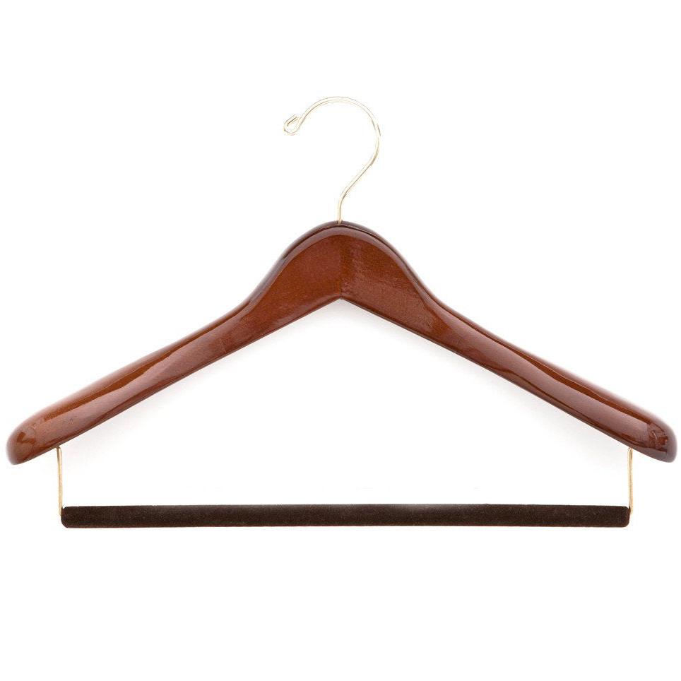 A KirbyAllison.com luxury wooden suit hanger to protect and extend the life garments.