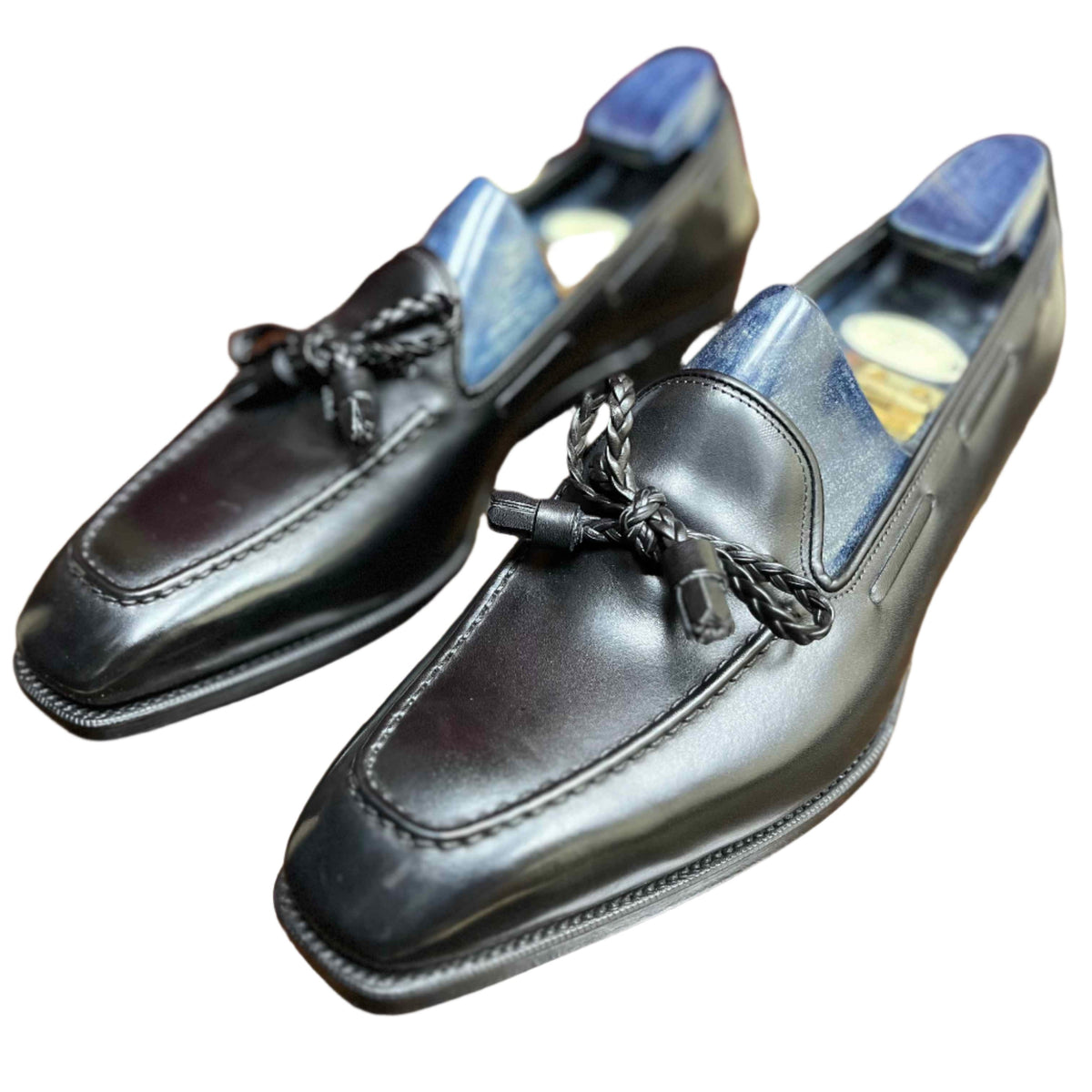 A pair of Anthony Cleverley Baron de Rede Black Casual Loafers, UK 9.0 Wide by KirbyAllison.com on a table.