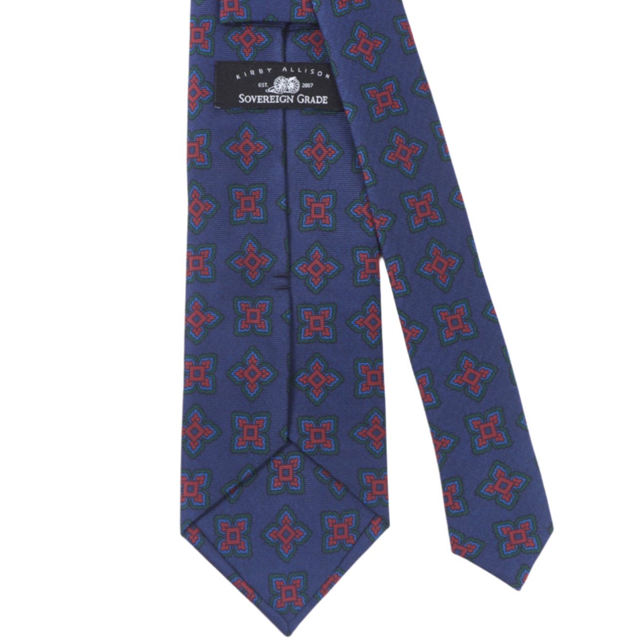 A Sovereign Grade Navy Large Medallion Ancient Madder Tie, 150cm by KirbyAllison.com, with blue and red designs, known for its longevity.