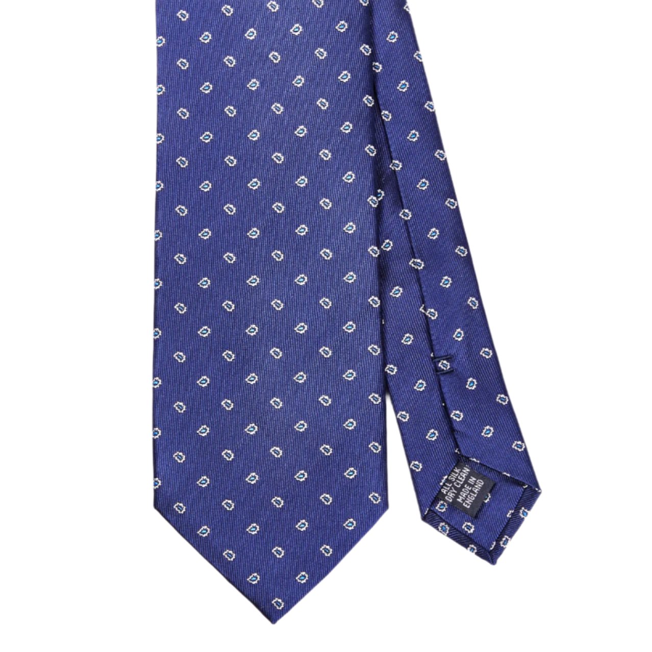 Handmade in the United Kingdom, the Sovereign Grade Navy Micro Paisley Jacquard Tie, 150 cm from KirbyAllison.com features white dots and is crafted with 100% English silk.