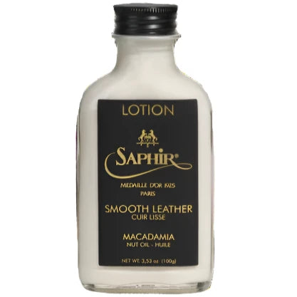 A bottle of Saphir Medaille d'Or Macadamia Conditioning Lotion by Soletech on a black background.