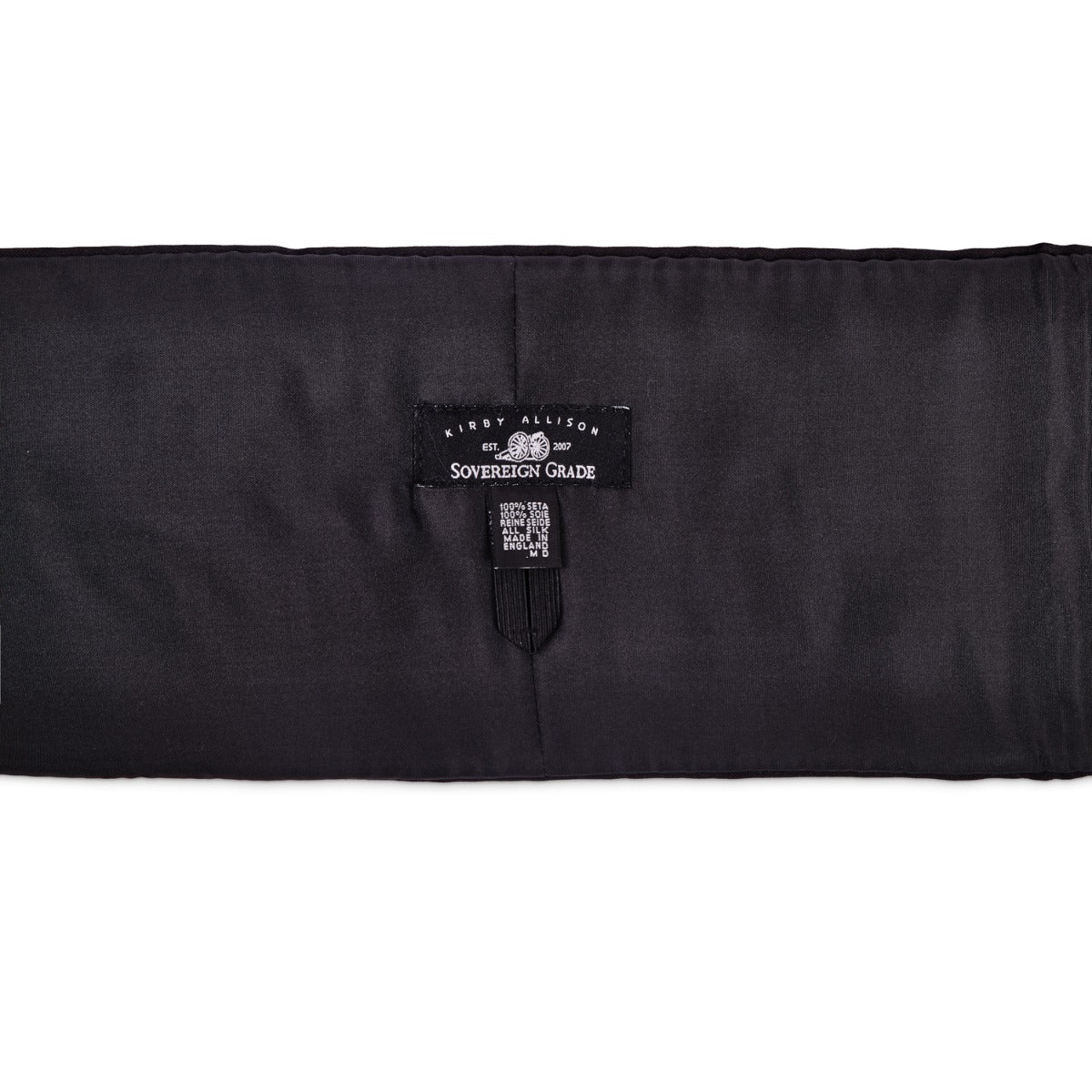 A Sovereign Grade Black Satin Cummerbund by KirbyAllison.com, with a label on it, often used as a formalwear accessory.