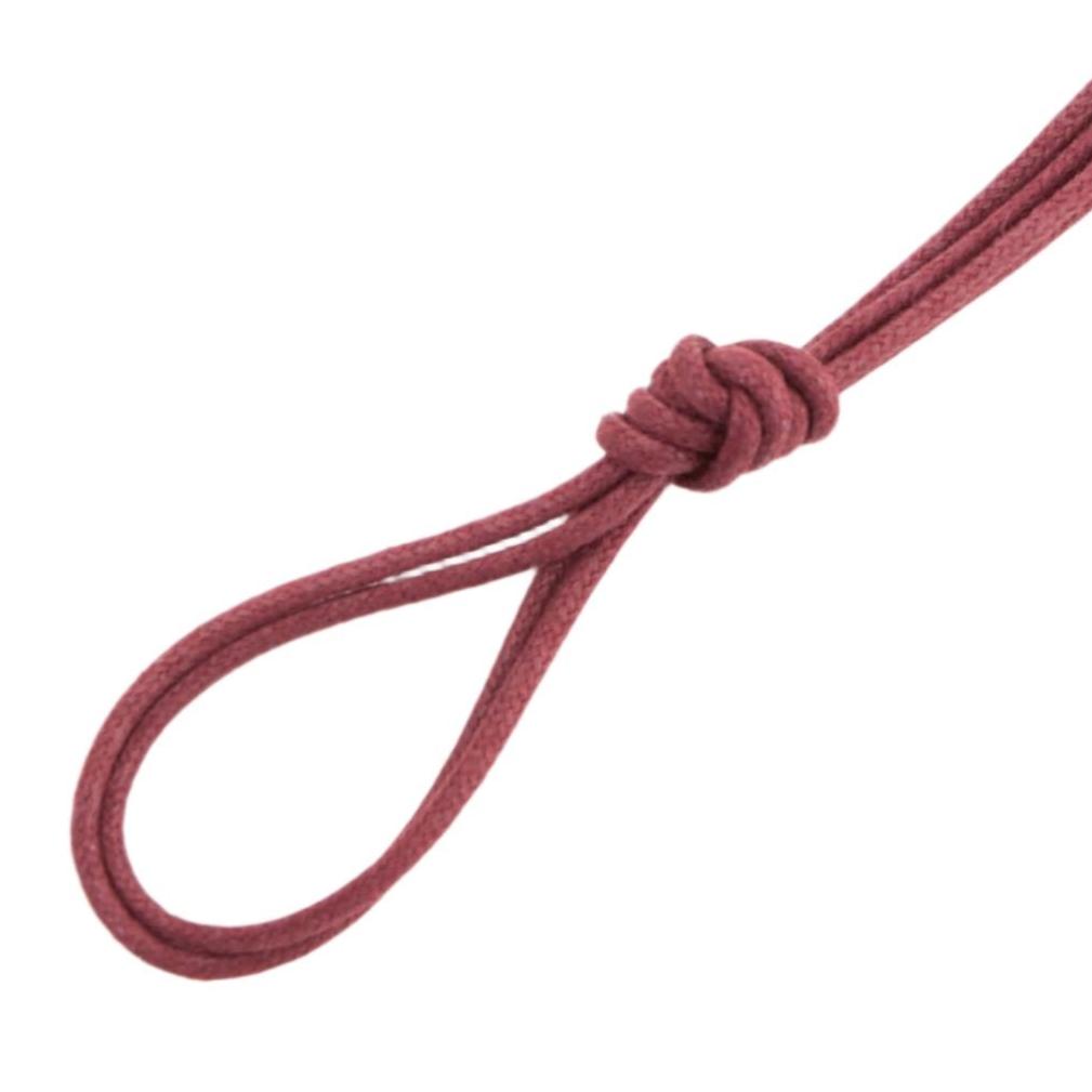 A Wellington Colored Round Waxed Shoelace replacement from KirbyAllison.com with a knot on it.