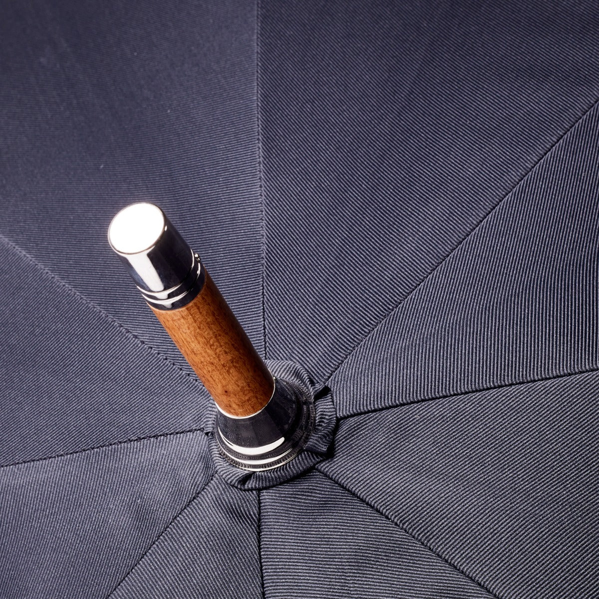 A Chestnut Solid Stick Umbrella with Black Canopy from KirbyAllison.com with a knob-end handle.