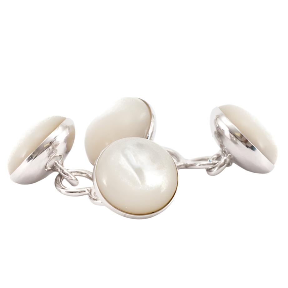 Three Mother of Pearl Silver Stone Capsule Cufflinks on a silver plate by KirbyAllison.com.