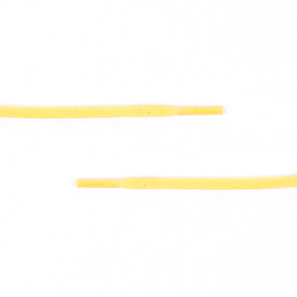 A pair of Colored Flat Waxed Shoelaces by KirbyAllison.com on a white surface.