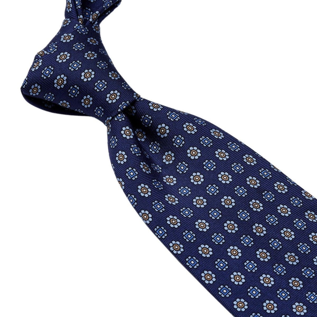 A handmade Sovereign Grade Navy Floral 36oz Printed Silk Tie, crafted from 100% English silk in the United Kingdom, by KirbyAllison.com.