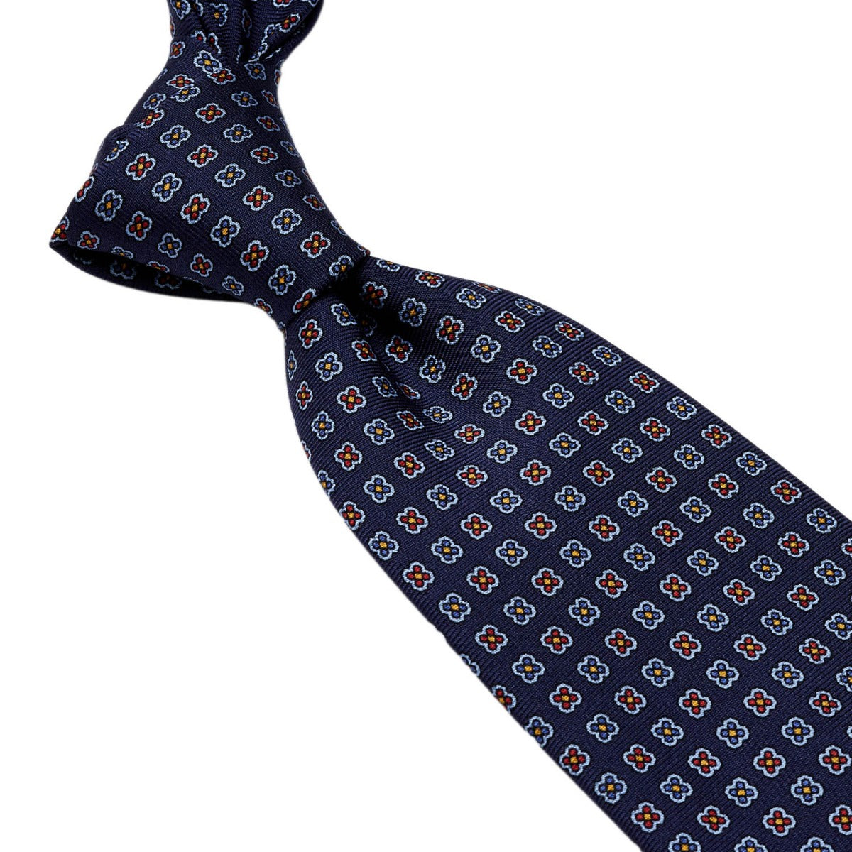 Handmade Sovereign Grade Navy Daisy 36oz Printed Silk Ties from the United Kingdom, featuring an orange and blue pattern, are available at KirbyAllison.com.