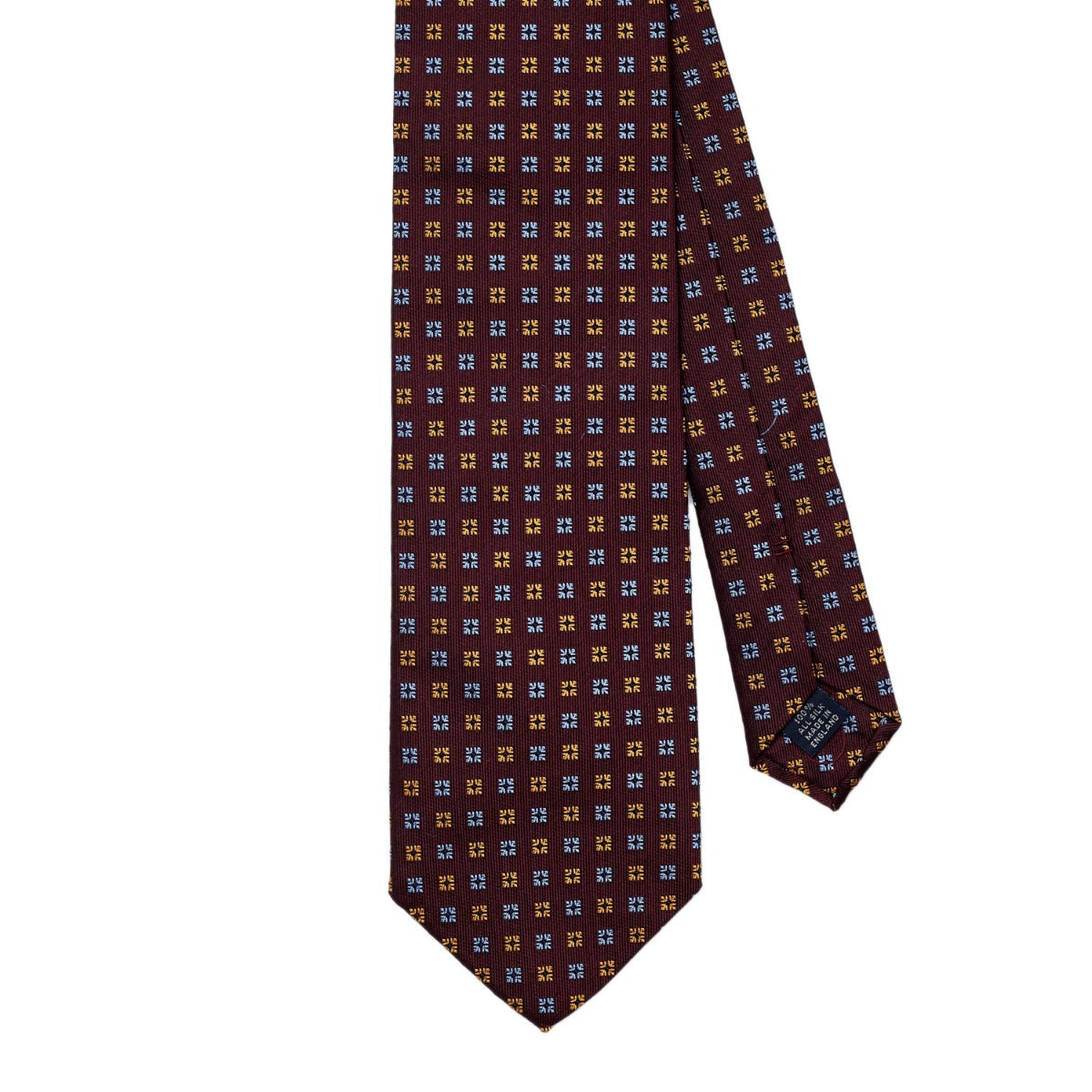 A Sovereign Grade Burgundy Diamond Motif Jacquard Tie with blue and brown squares, handmade for longevity from KirbyAllison.com.