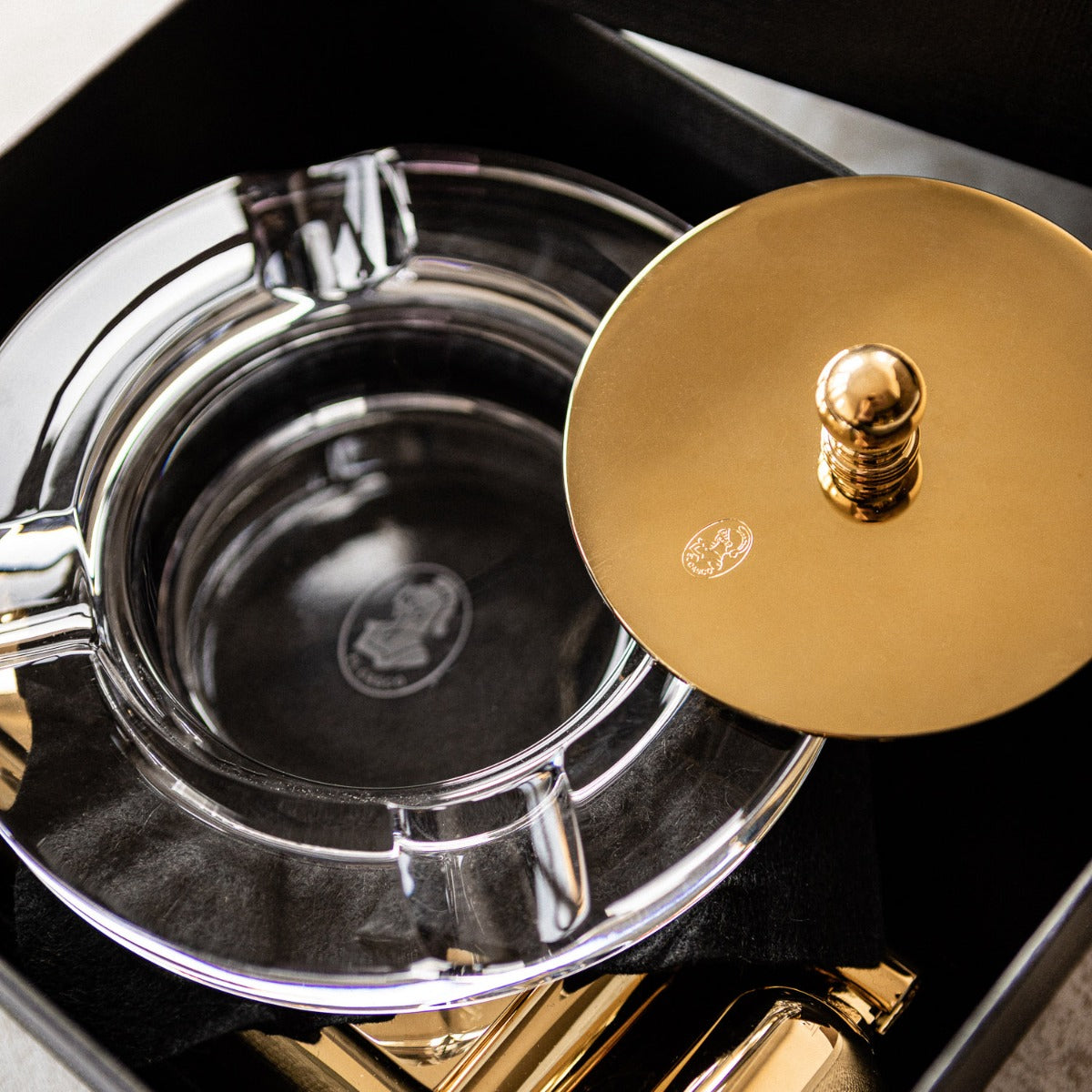 An El Casco Executive Cigar Ash Tray (Gold) in a black box by El Casco.