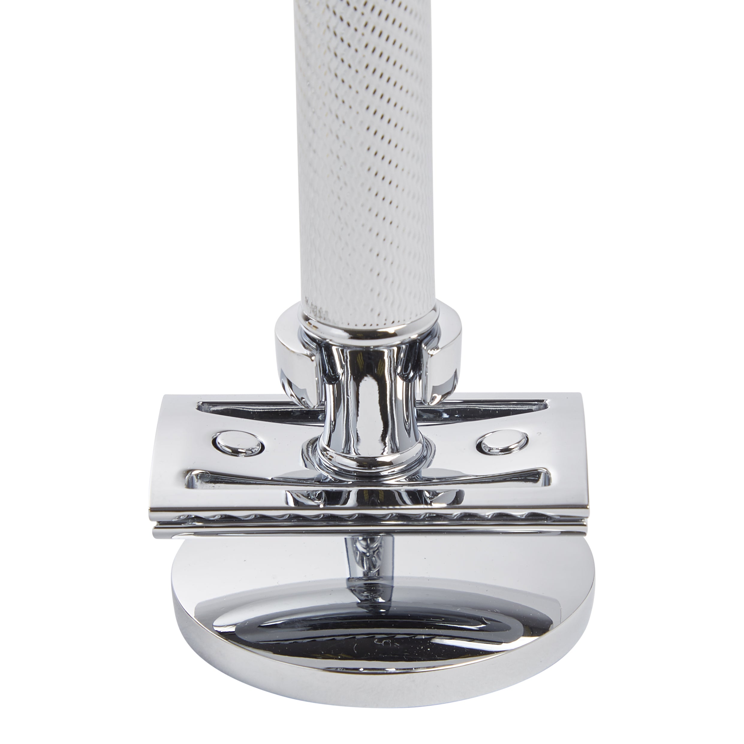 An elegant man's bathroom accessory - a chrome shaving razor on top of a KirbyAllison.com Safety Razor Stand.