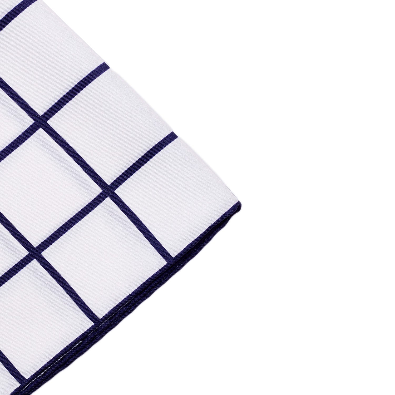 A Sovereign Grade Prince of Wales Pocket Square, White/Navy by KirbyAllison.com on a white surface.