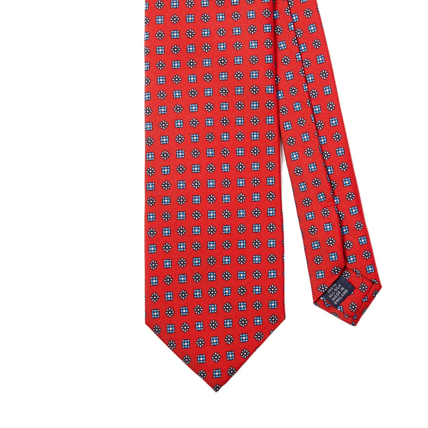 A Sovereign Grade Red Floral 25oz Silk Hopsack Tie (150x8.5 cm) with handmade blue and white polka dots from KirbyAllison.com.