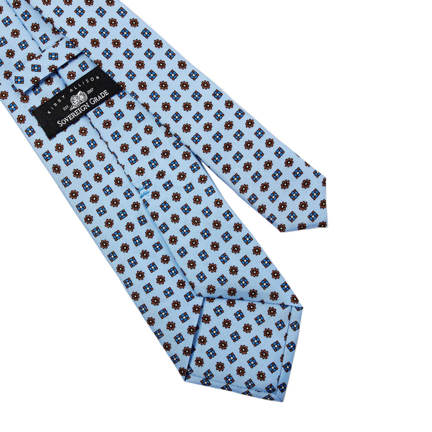 A Sovereign Grade Baby Blue Floral 25oz Silk Hopsack Tie (150x8.5 cm) by KirbyAllison.com, handmade with blue and brown polka dots on a white background.