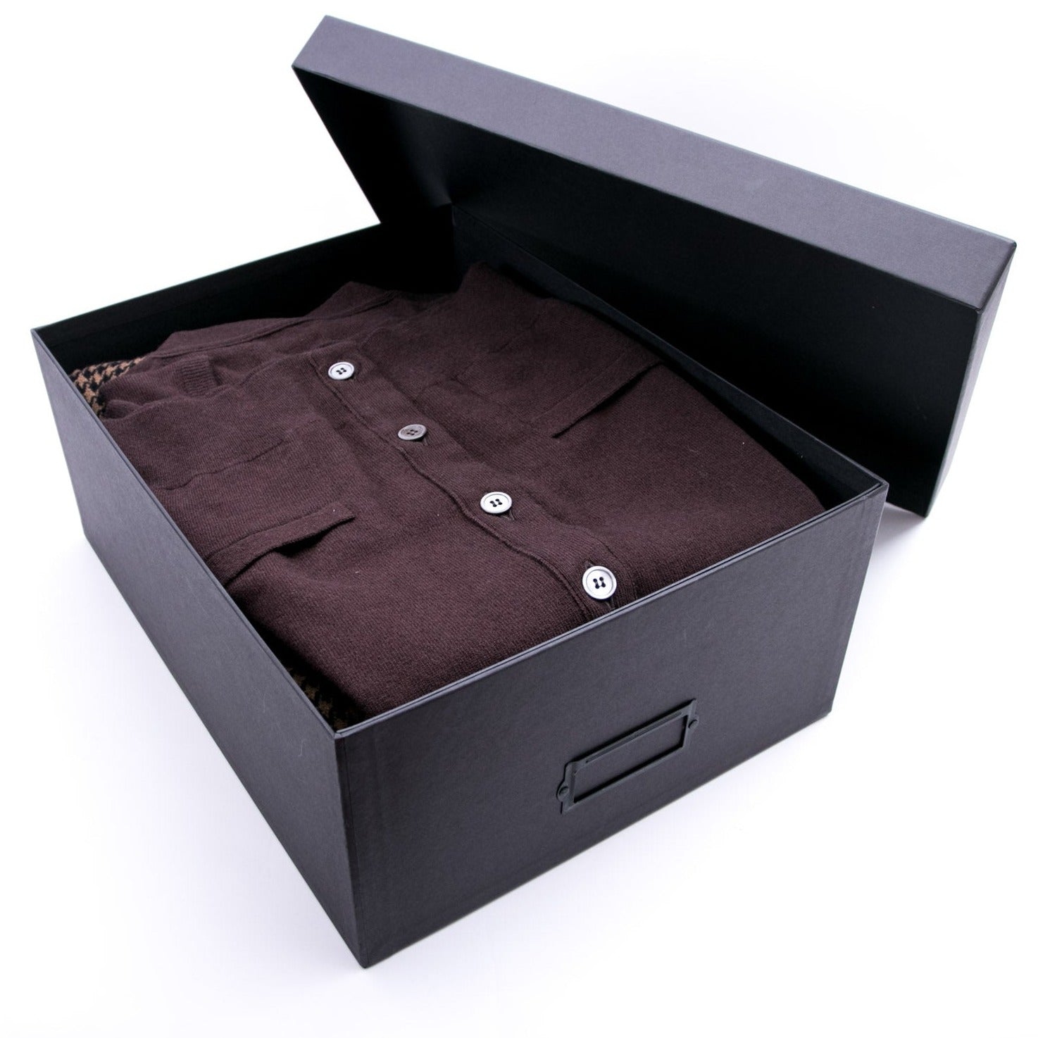 A black Hanger Project Garment Storage Box from KirbyAllison.com with a brown shirt inside.