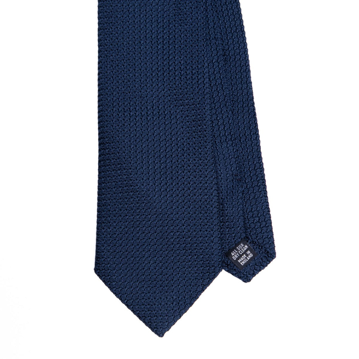 A highest quality handmade Sovereign Grade Grenadine Grossa Dark Navy Tie on a white background, made by KirbyAllison.com.