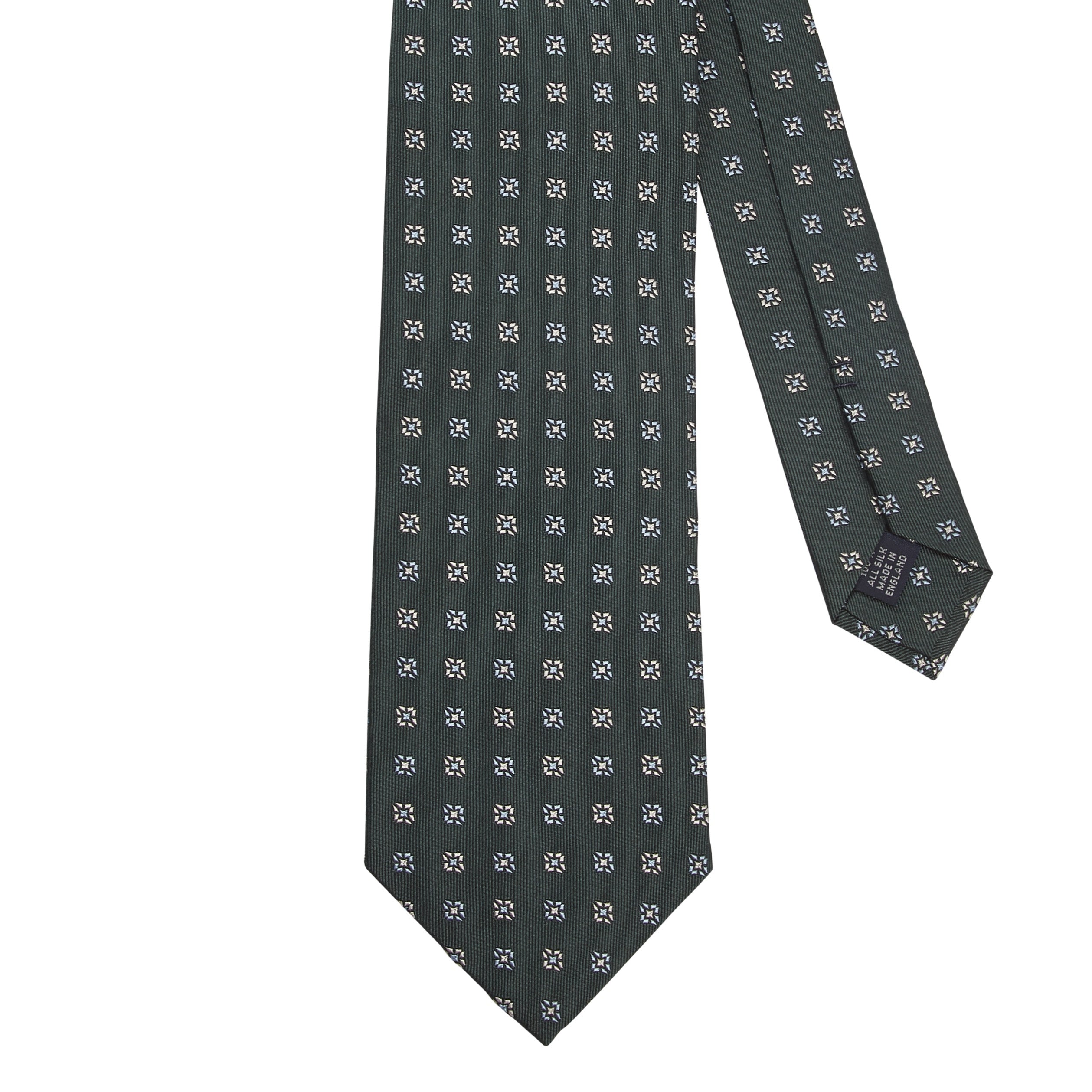 A Sovereign Grade Forest Green Square Floral Jacquard Tie from KirbyAllison.com adorned with white and black polka dots.