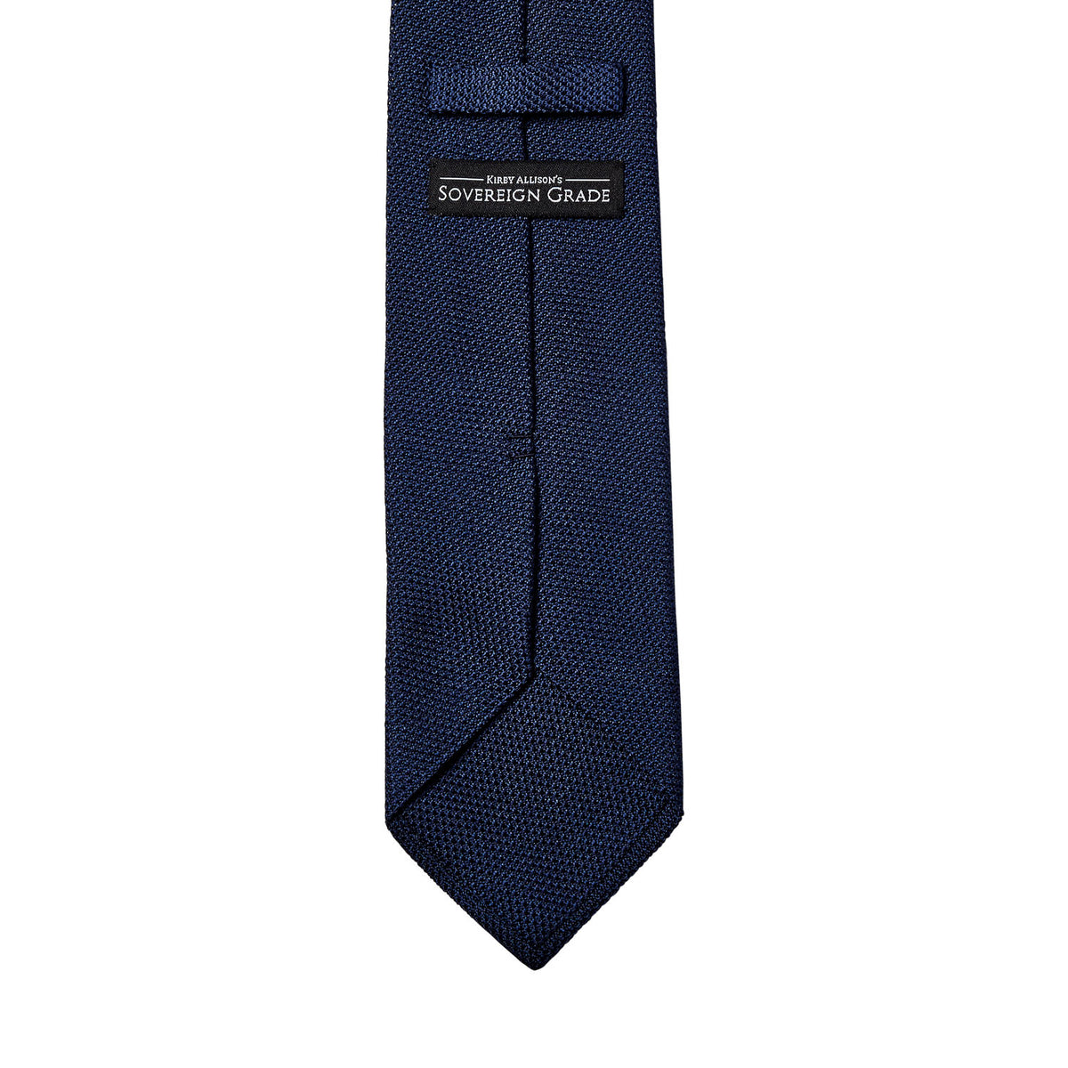 A Sovereign Grade Grenadine Fina Dark Navy Tie on a white background by KirbyAllison.com.