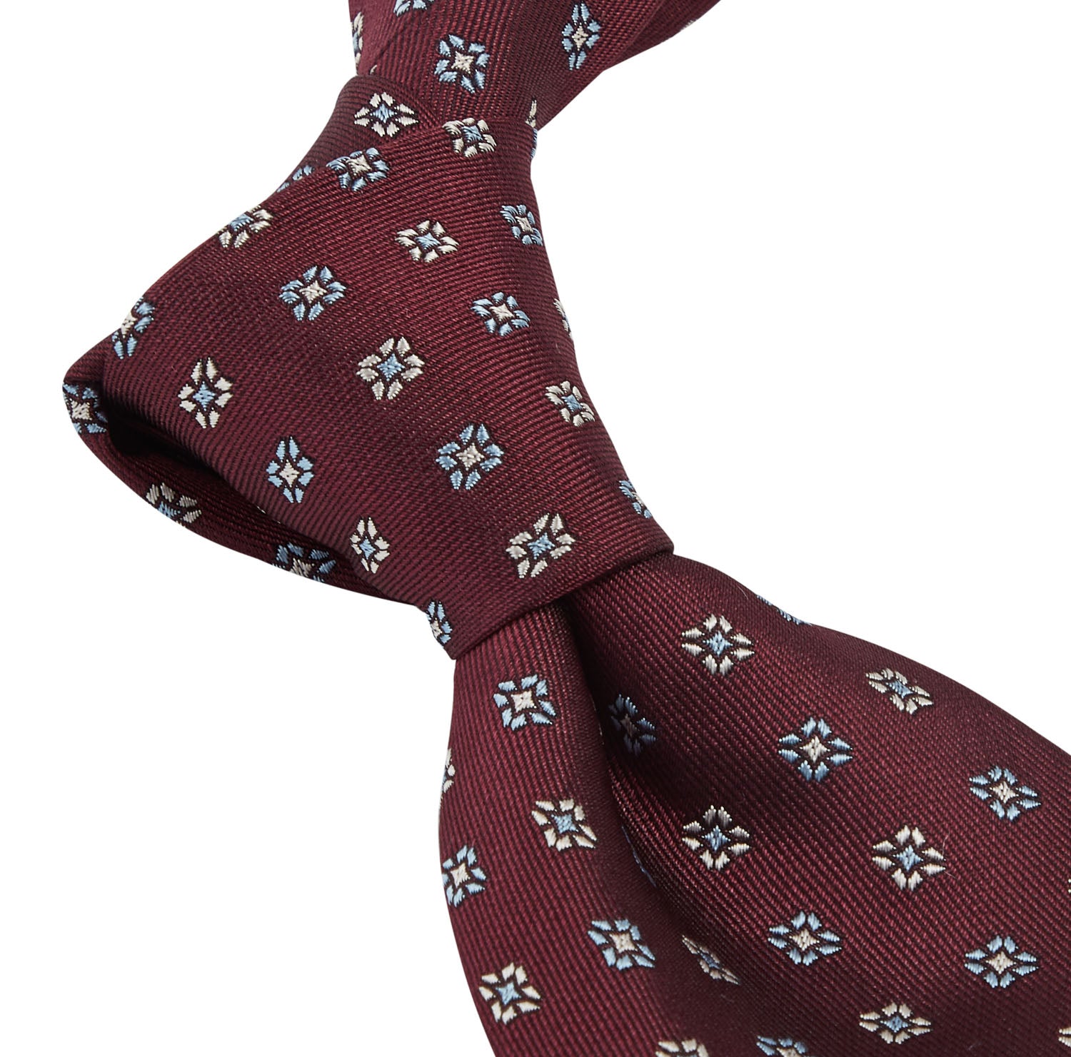 A Sovereign Grade Oxblood Square Floral Jacquard Tie by KirbyAllison.com, featuring blue and white flowers, showcasing quality craftsmanship.