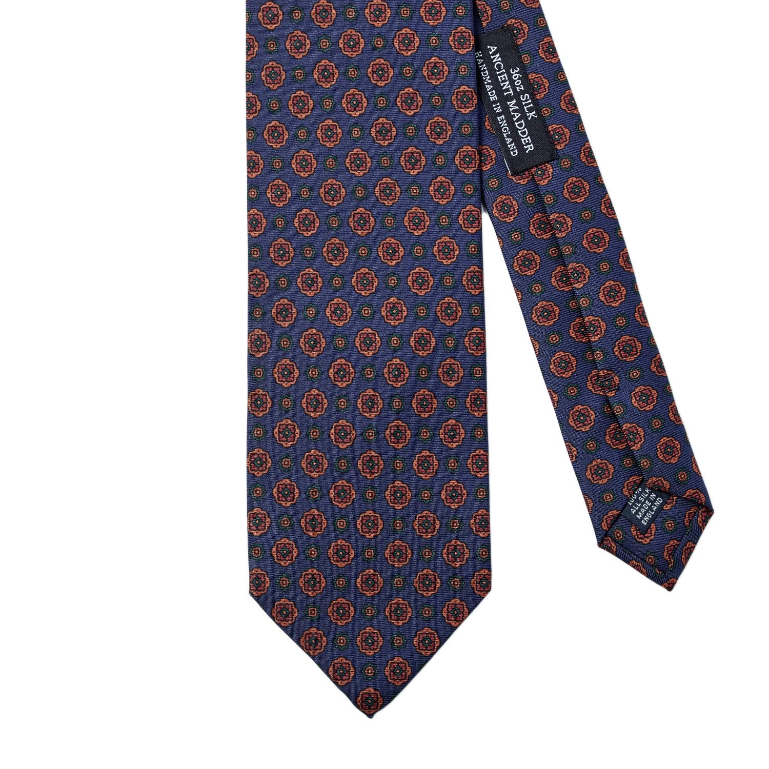 A Sovereign Grade Navy Geometric Floral Ancient Madder Tie (150x8.5 cm) by KirbyAllison.com with a vibrant orange and blue pattern.