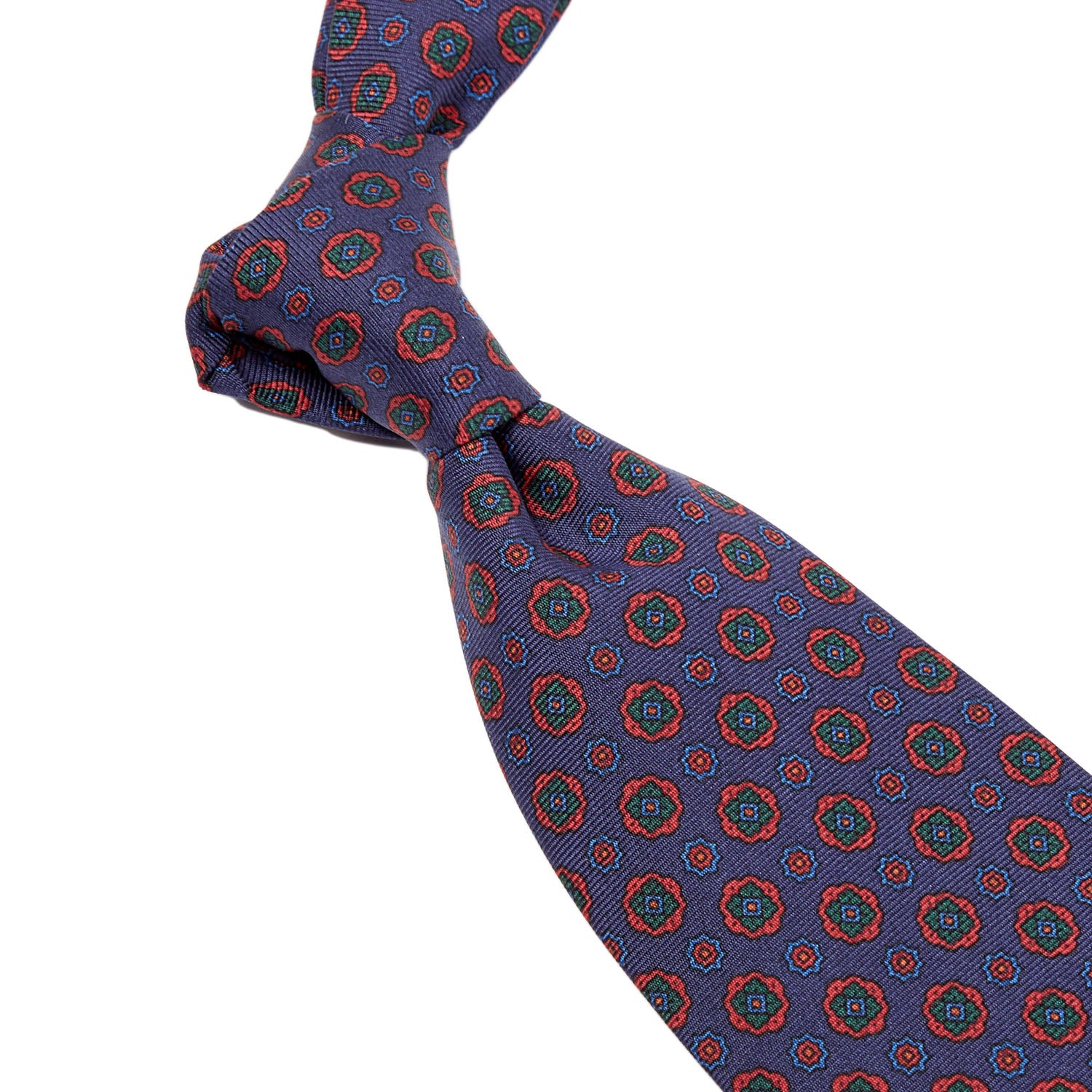 A Sovereign Grade Dark Navy Geometric Floral Ancient Madder Tie (150x8.5 cm) with red and blue circles on it, handmade in the United Kingdom, by KirbyAllison.com.