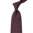 A quality KirbyAllison.com Sovereign Grade Burgundy Daisy 36oz Printed Silk Tie with blue squares.