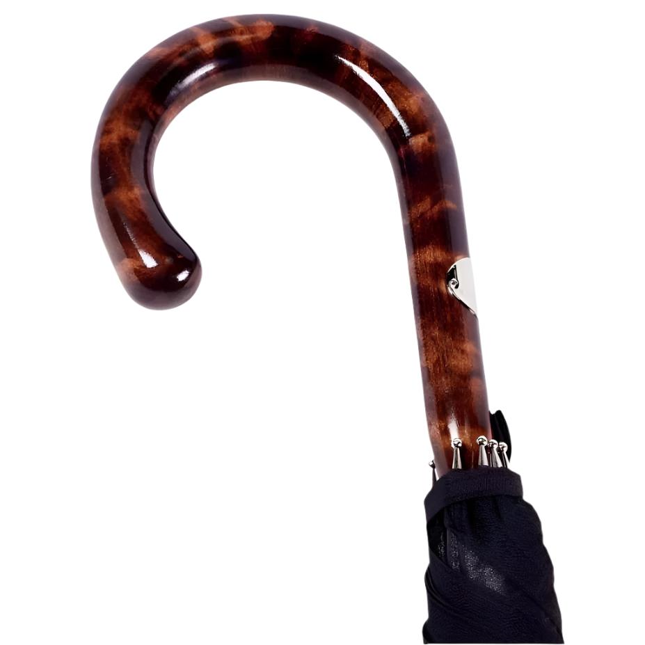 A KirbyAllison.com solid-stick umbrella with a Shiny Tiger Maple Handle and Imperial Black Canopy.