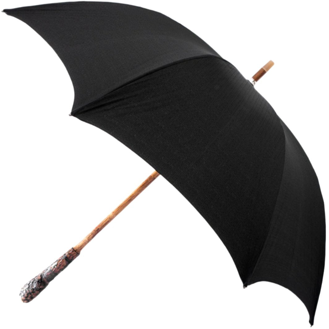 A Manila Root Solid Stick umbrella with an Imperial Black poly-cotton canopy by KirbyAllison.com.