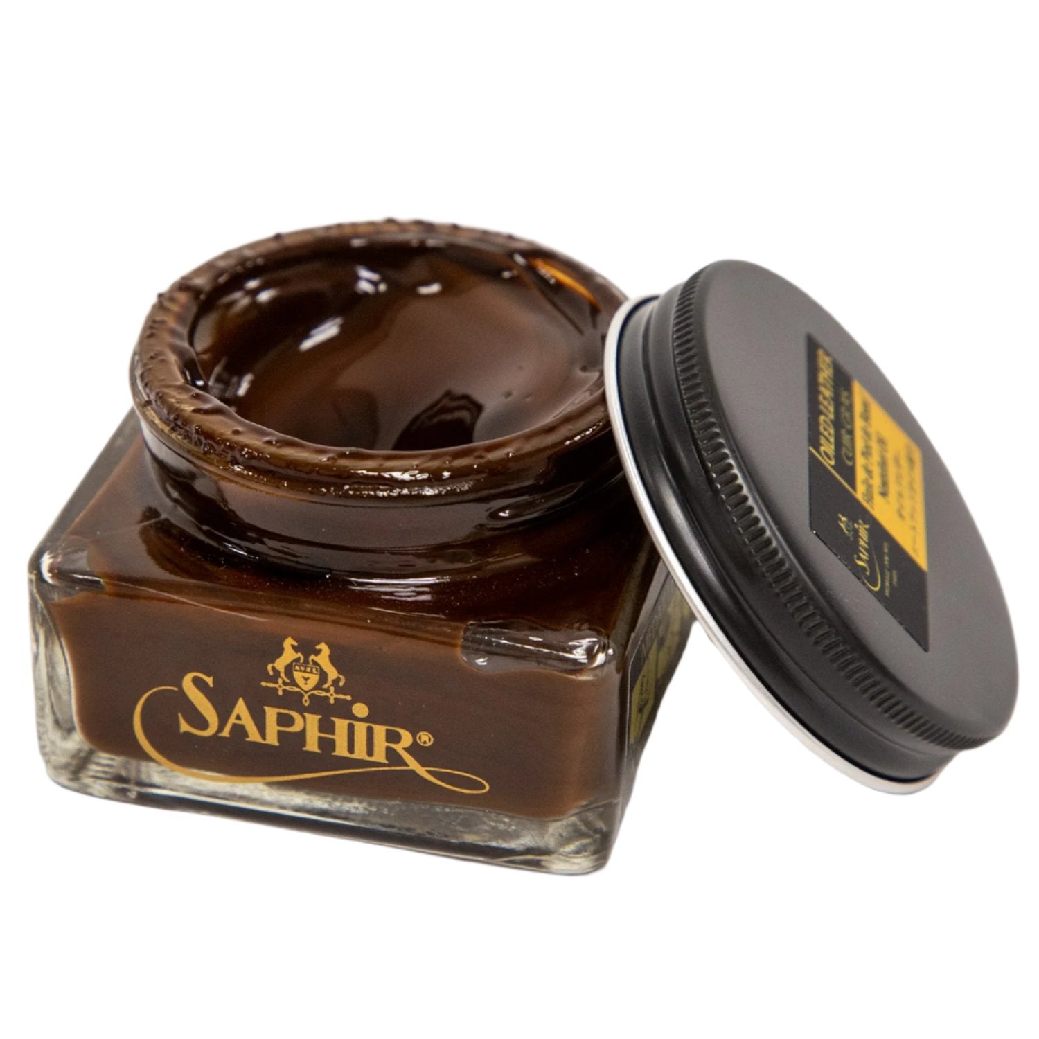 A jar of Saphir Medaille d'Or Oiled Leather Cream for Chromexcel made by KirbyAllison.com sitting on top of a white surface.