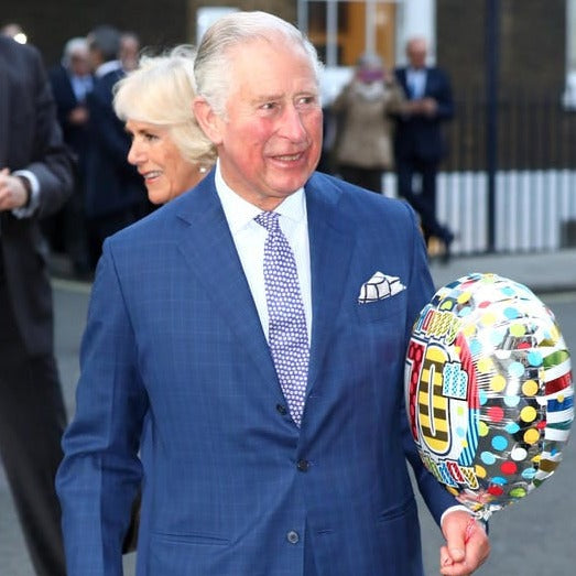 The duke and duchess of cambridge are holding Sovereign Grade Prince of Wales Pocket Squares by KirbyAllison.com.