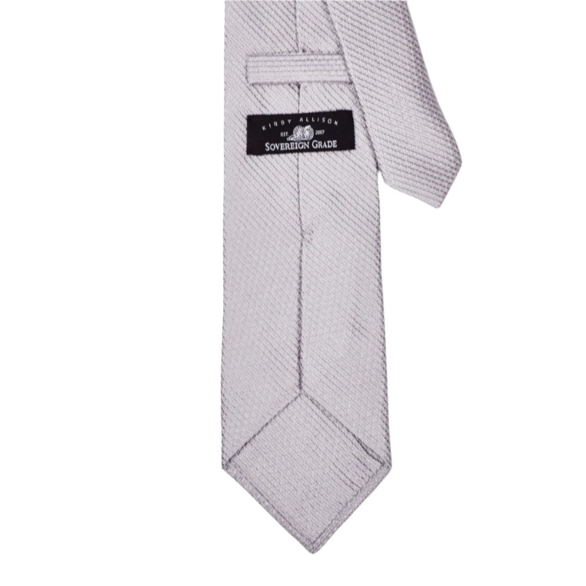 A Sovereign Grade Silver Jacquard Mock Grenadine necktie made of 100% English silk with a black tag on it, from KirbyAllison.com.