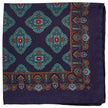 A Sovereign Grade 100% Silk Navy Pocket Square with a blue paisley pattern on a white background, from KirbyAllison.com.