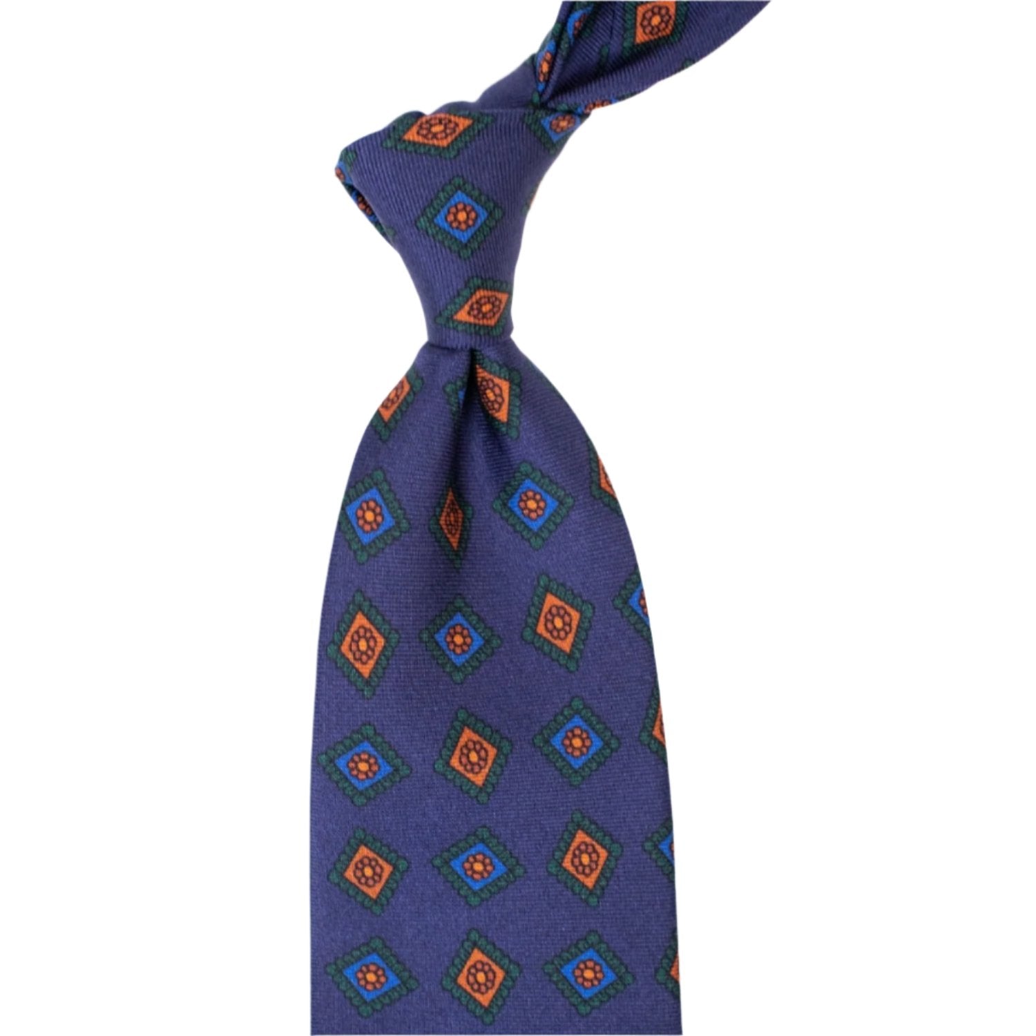 A KirbyAllison.com Sovereign Grade Navy w/Green Art Deco Ancient Madder tie with a diamond pattern of quality.